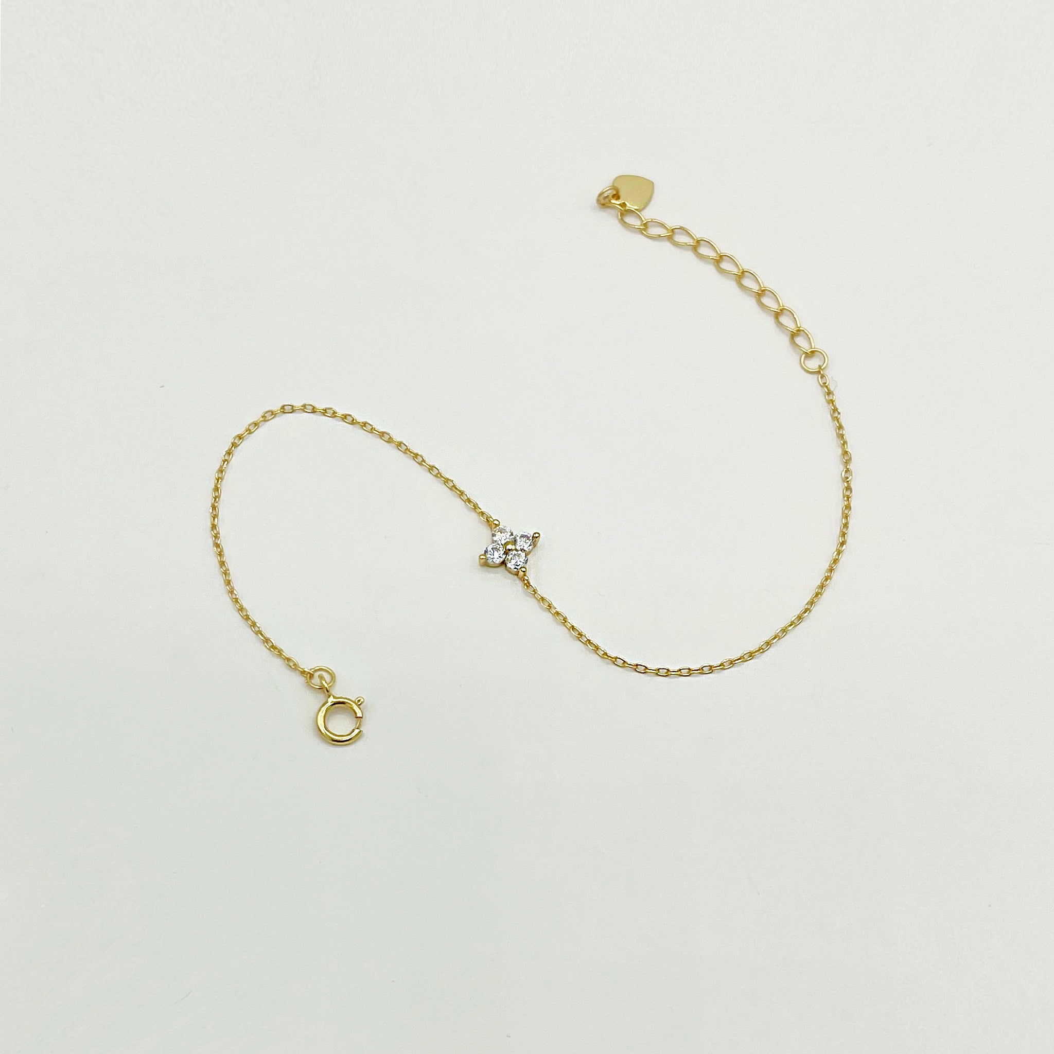 18k gold plated sterling silver dainty bracelet with small floral clear stones and clasp fastening