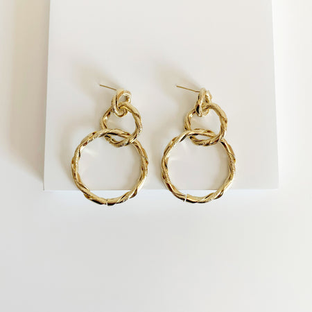 Gold twisted circle linked drop earrings 