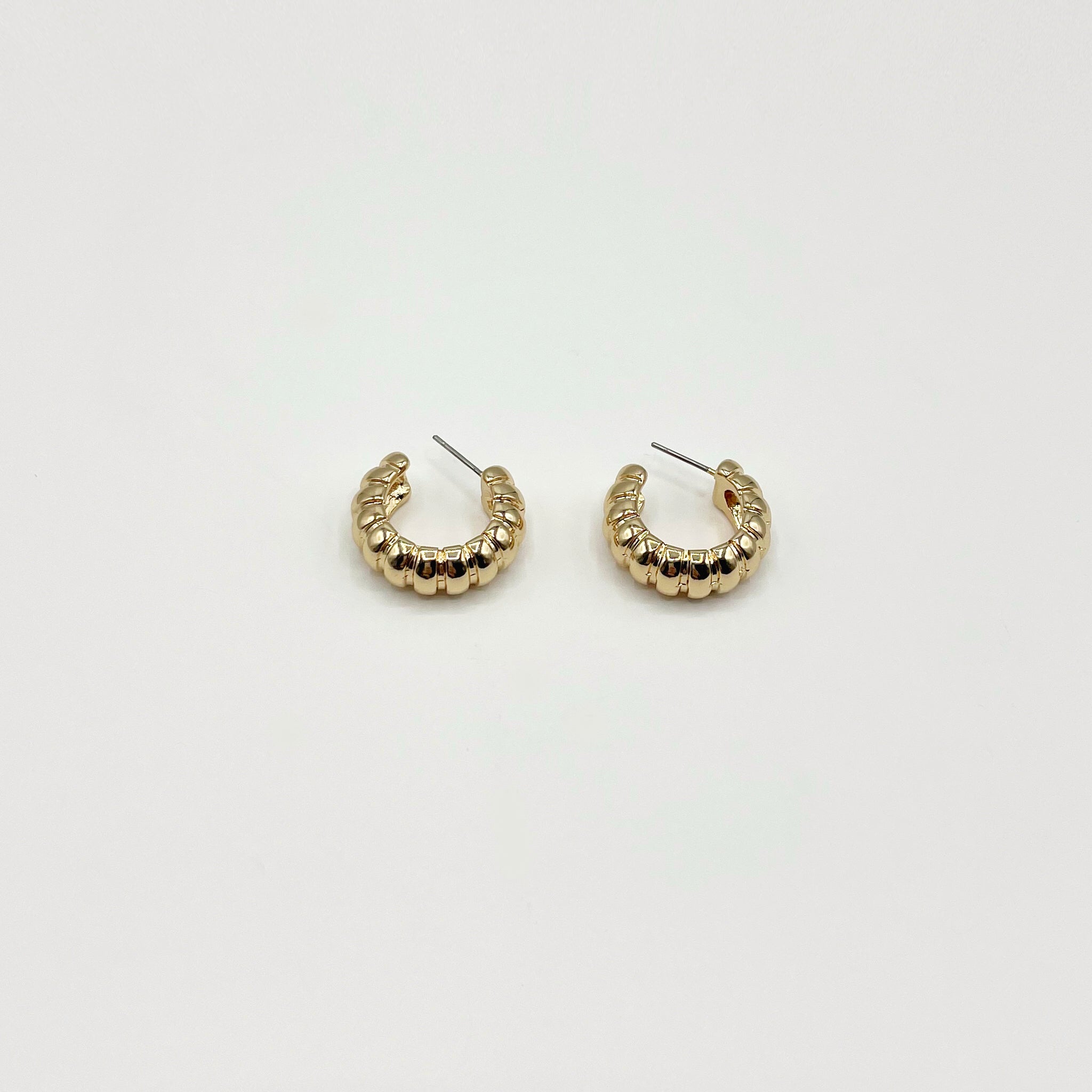 Chunky gold hoop earrings with rib texture 