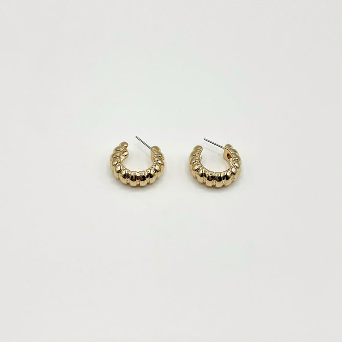 Chunky gold hoop earrings with rib texture 