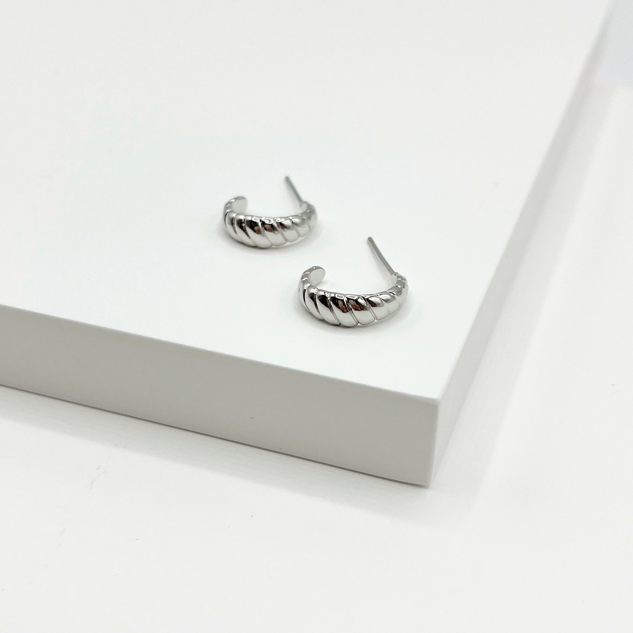 Silver semi circle stud earrings with diagonal texture 