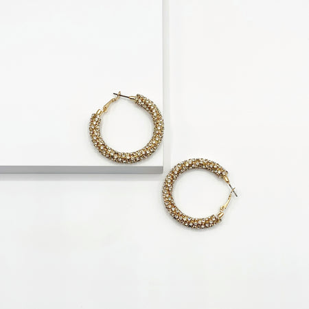 Gold hoop earrings paved with rhinestones 