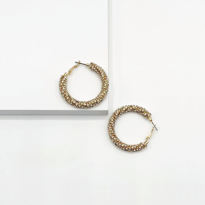 Gold hoop earrings paved with rhinestones 