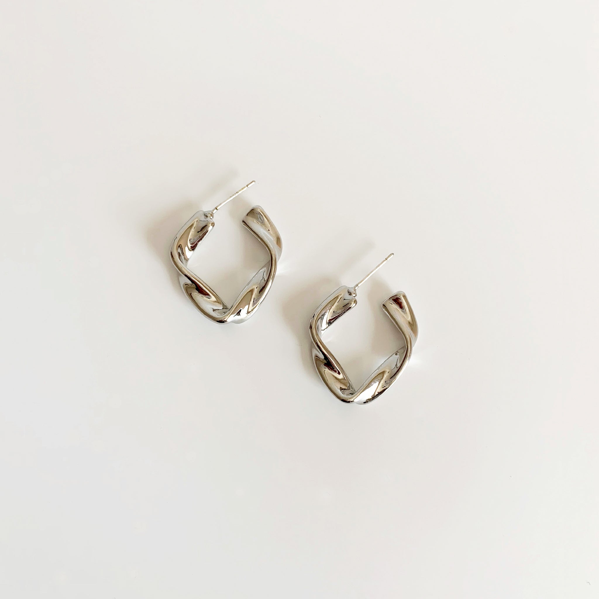 Silver twisted geometric hoop earrings 