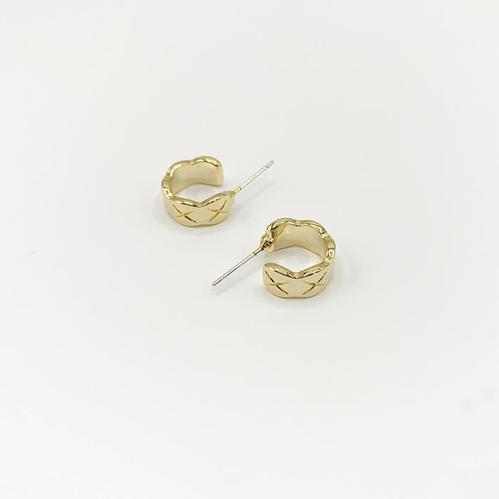 Small 14k gold plated mini hoop earrings with central etched cross design 